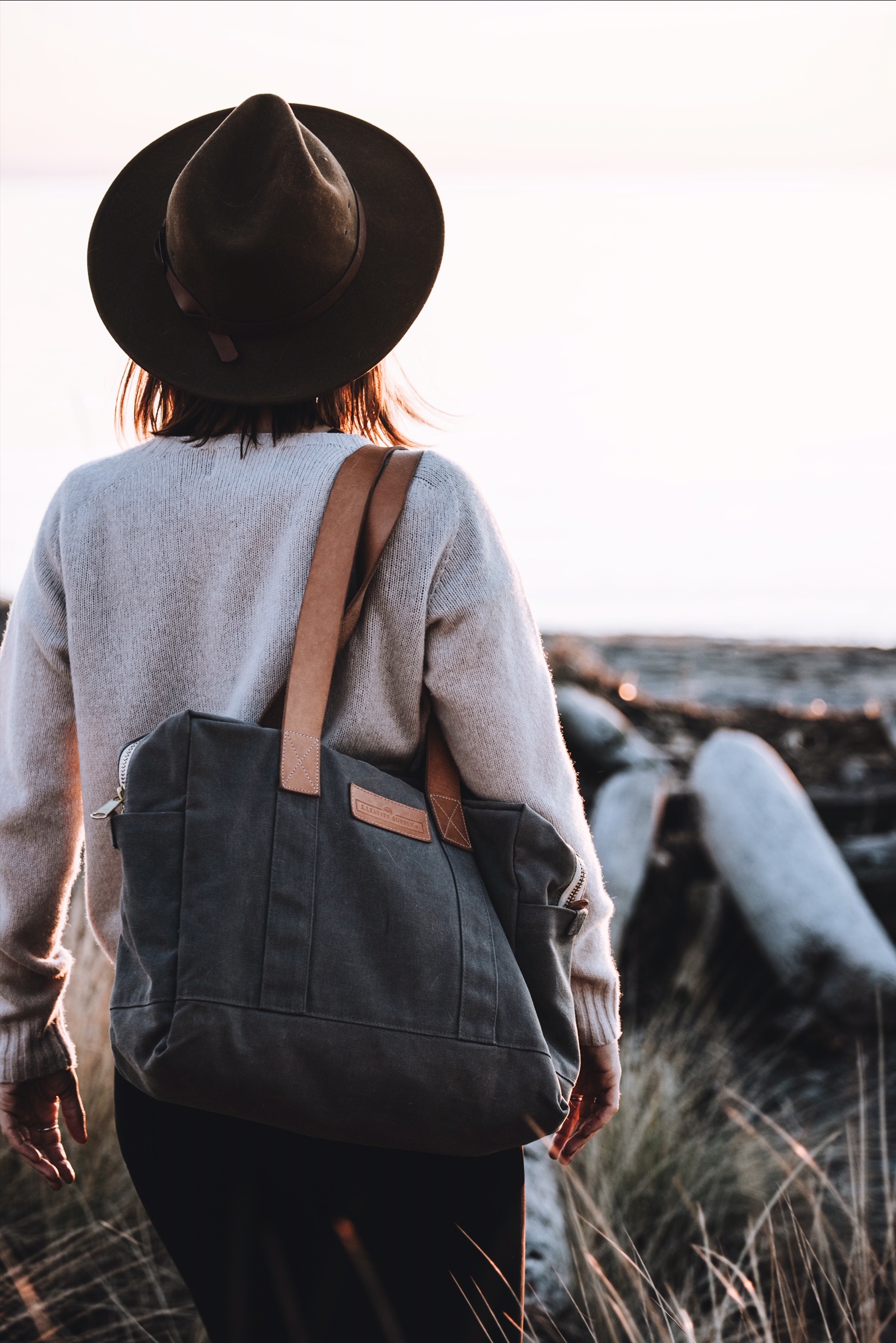 woman carrying grey Gallatin Carryall