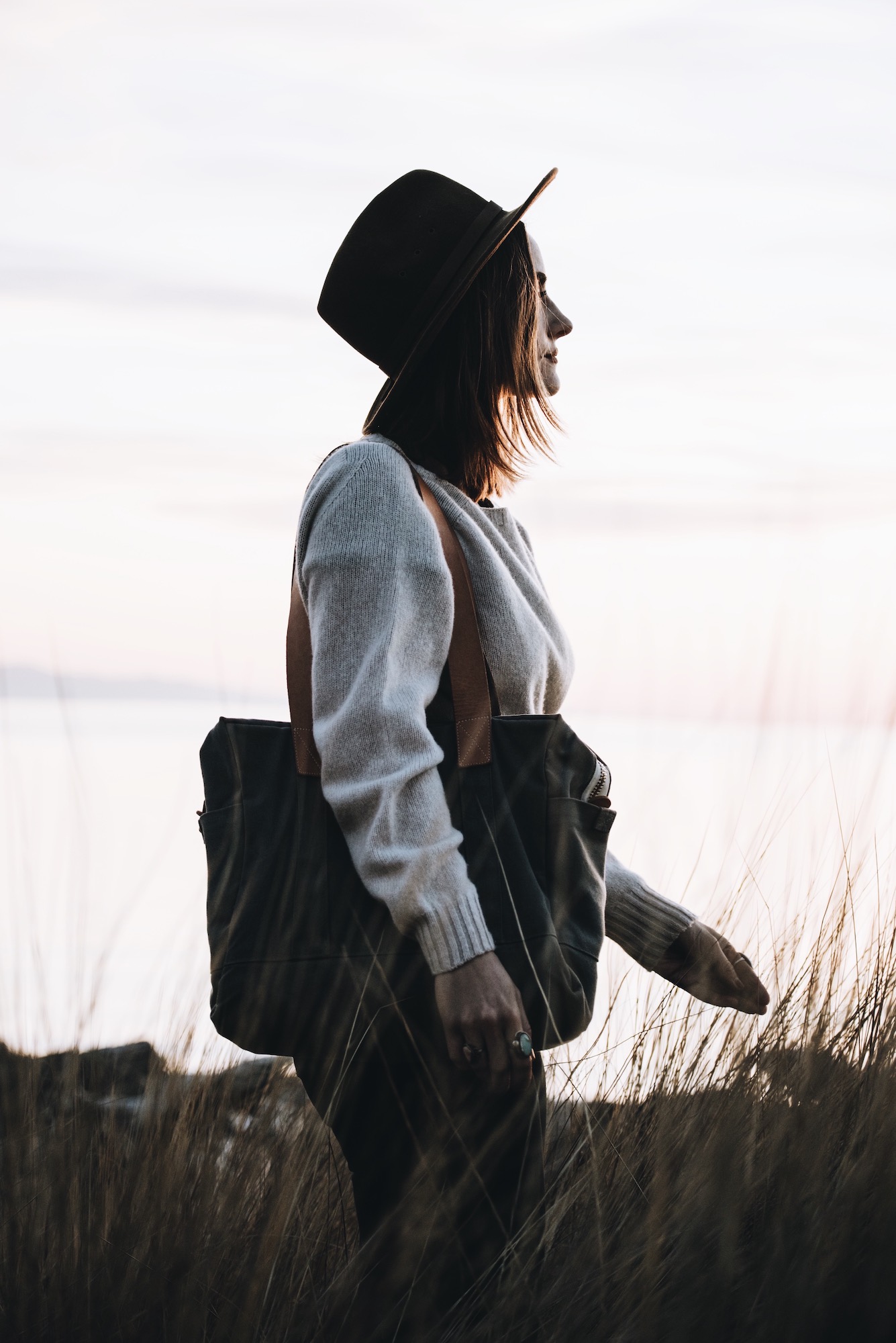 woman carrying grey Gallatin Carryall